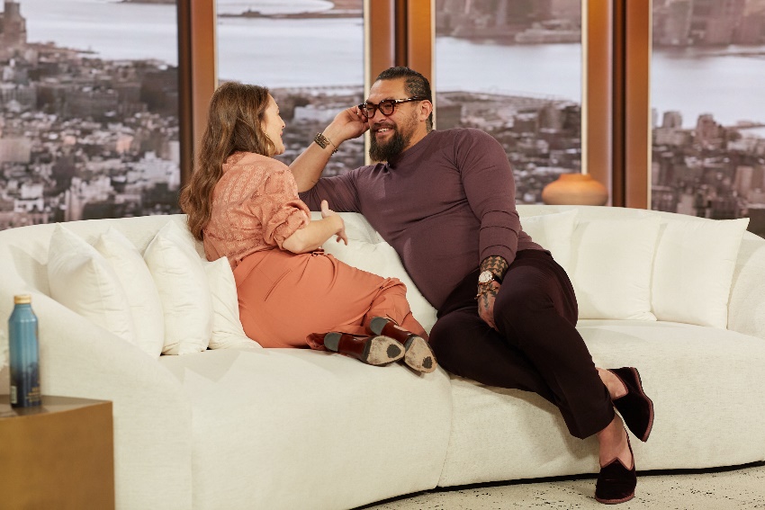 A person and person sitting on a couchDescription automatically generated