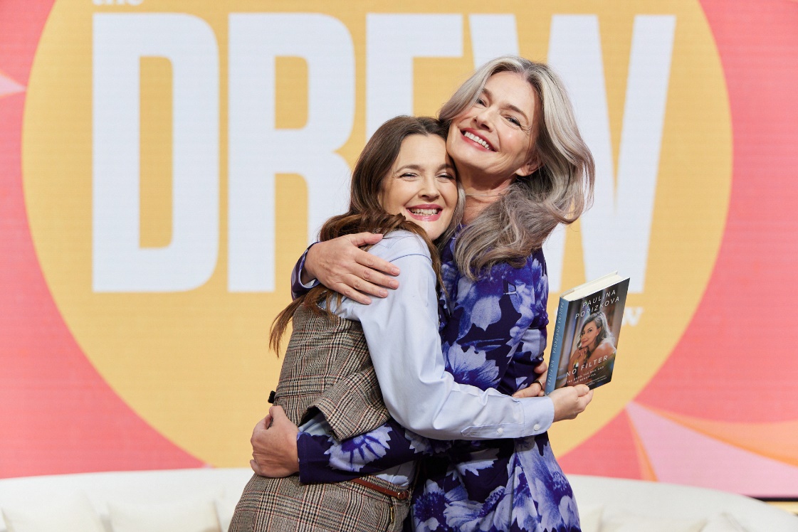 Two women hugging each otherAI-generated content may be incorrect.