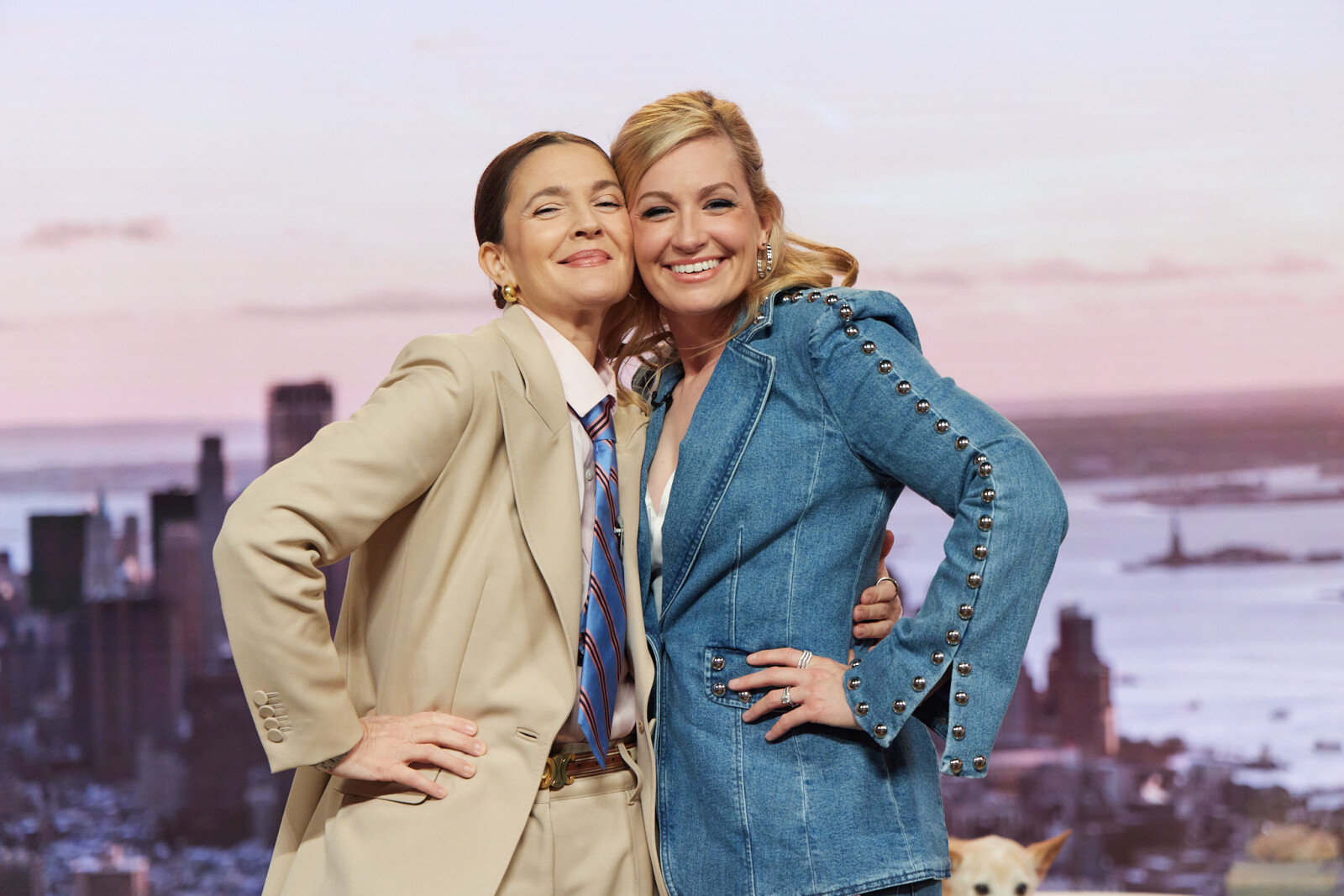 A couple of women posing for a pictureAI-generated content may be incorrect.