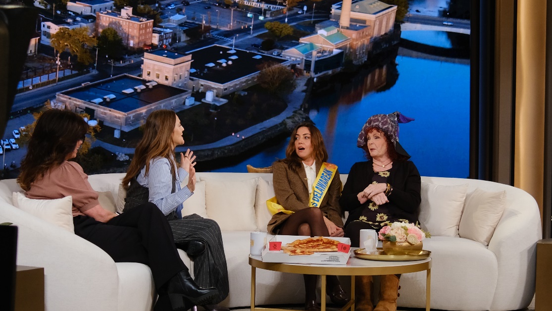 A group of people sitting on a couchAI-generated content may be incorrect.