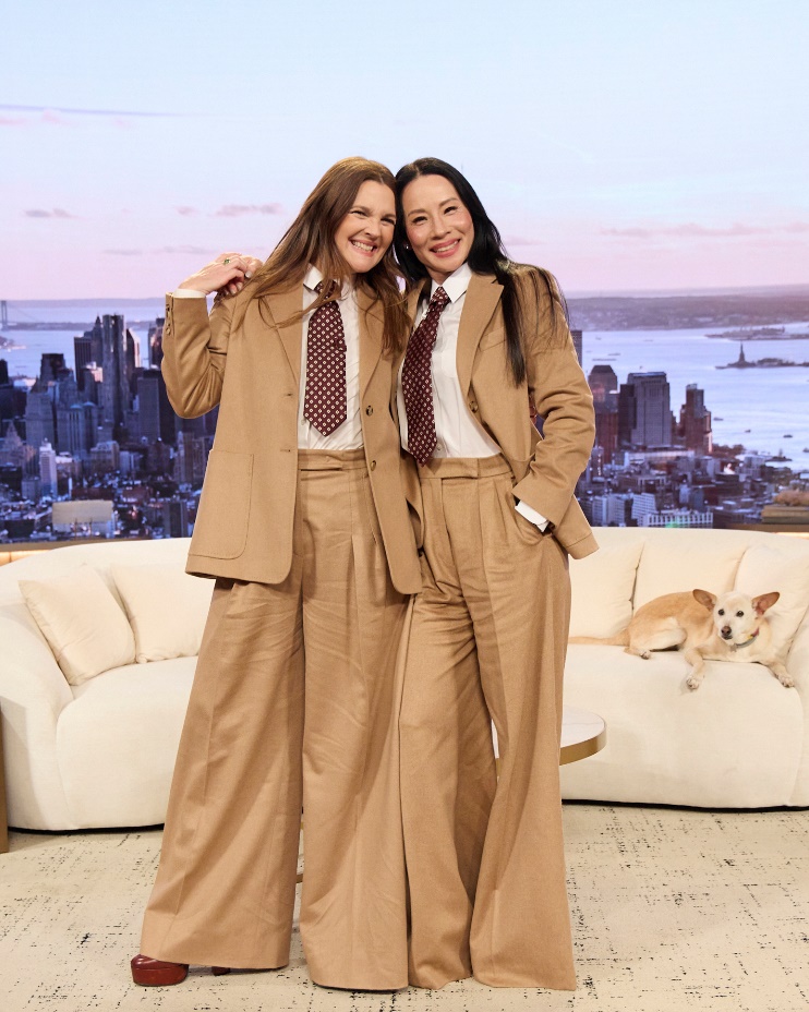 Two women in brown suitsAI-generated content may be incorrect.