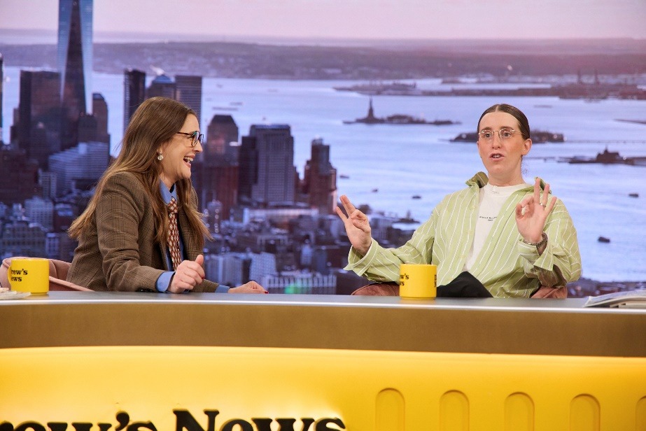 A couple of women sitting at a deskAI-generated content may be incorrect.