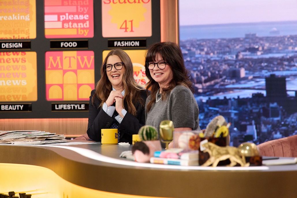 Two women sitting at a deskAI-generated content may be incorrect.