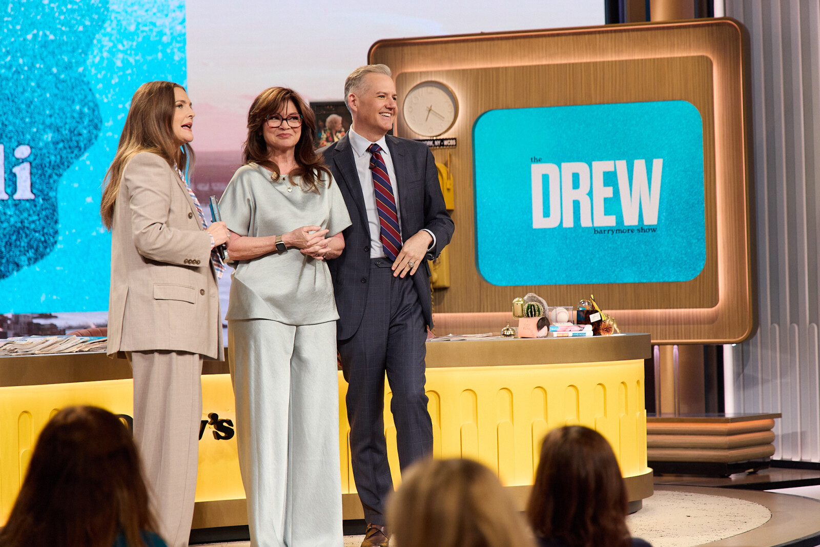 A group of people standing on a stageAI-generated content may be incorrect.