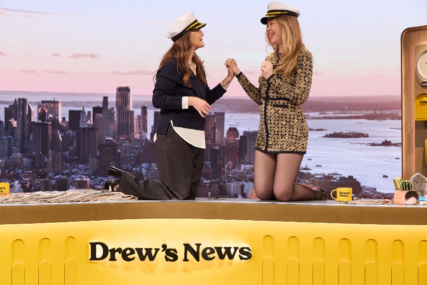 Two women in hats holding handsAI-generated content may be incorrect.