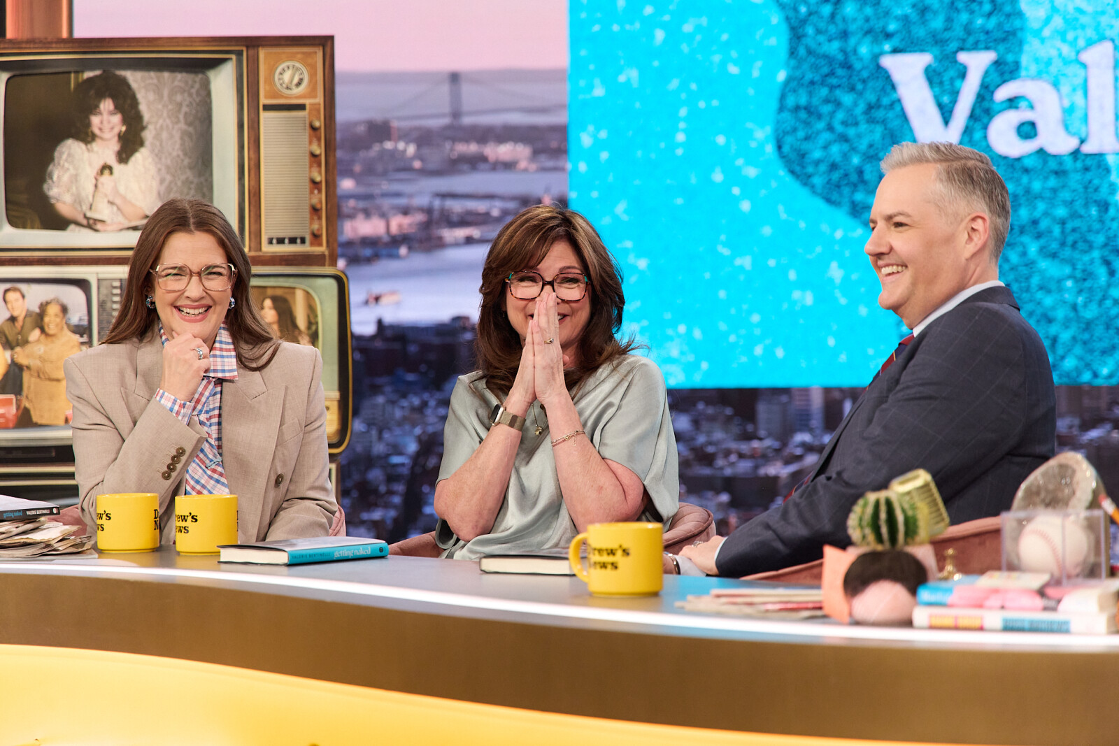 A group of people sitting at a tableAI-generated content may be incorrect.