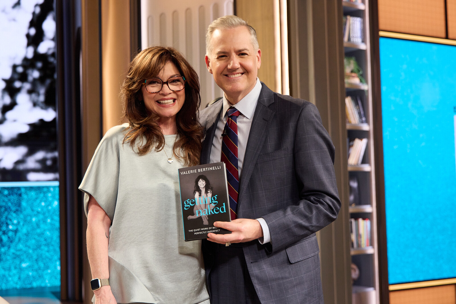 A person and person holding a bookAI-generated content may be incorrect.