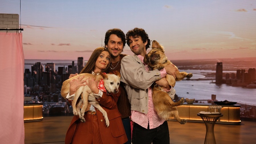 A group of people holding dogsAI-generated content may be incorrect.