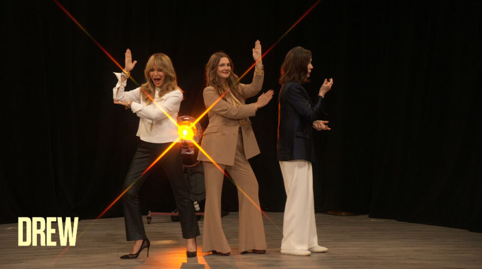 A group of women dancing on stageDescription automatically generated