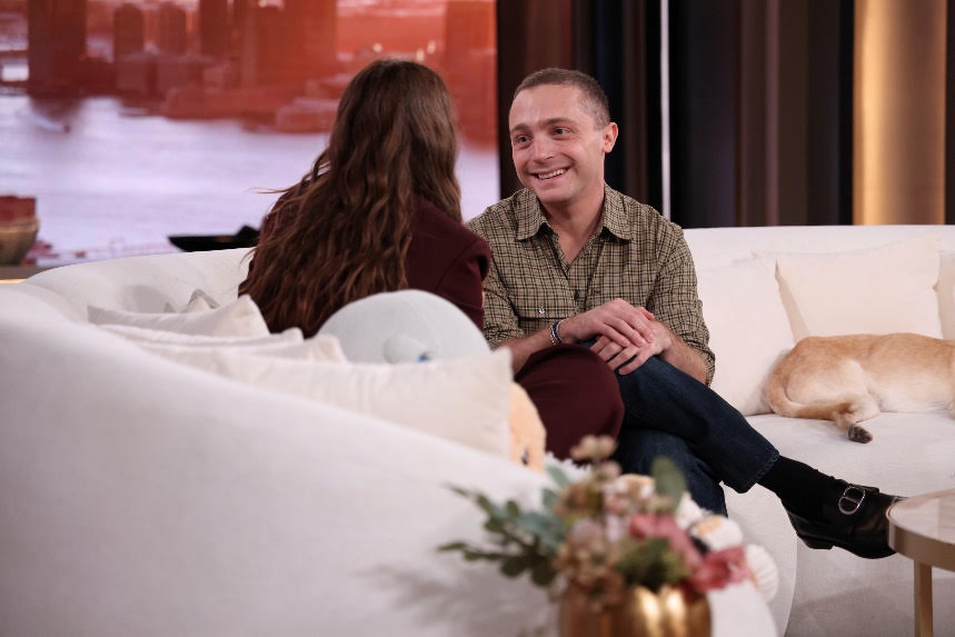 A person and person sitting on a couchDescription automatically generated